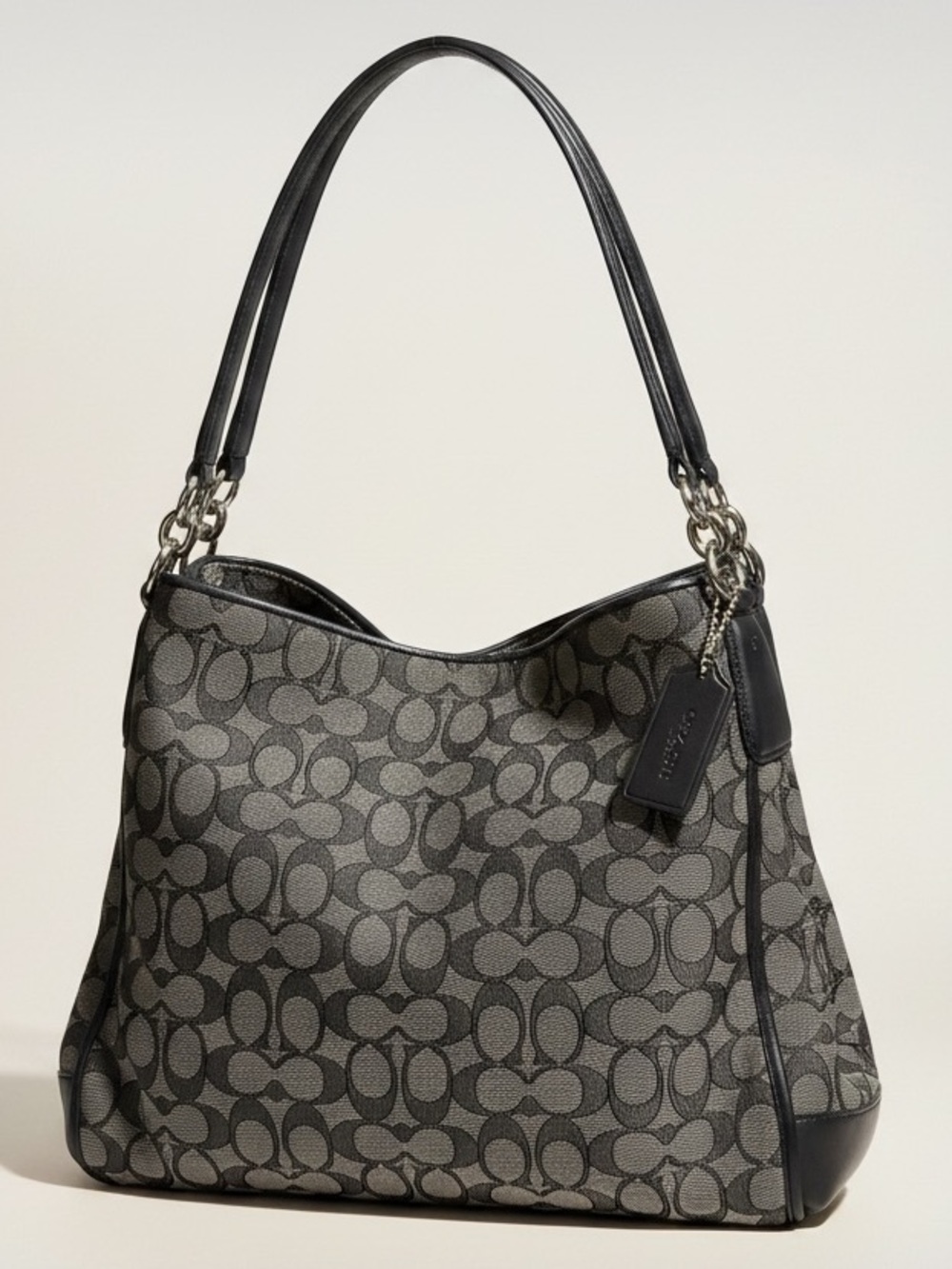 Coach Phoebe Shoulder/Hobo bag in black and gray signature jacquard canvas.